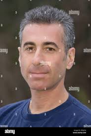 Steve Greenfield poses in his New Paltz, N.Y. home