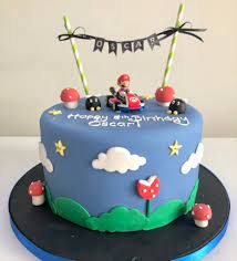 Make a cake shaped like a nintendo game cartridge with mario and the crew on the cover. Mario Kart Birthday Cake Etoile Bakery