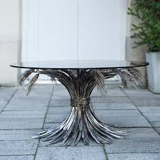 This table looks very original and provides good space for snacks, drinks, etc. Coco Chanel Silver Plated Coffee Table Schlicht Designmobel