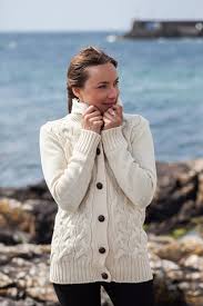 The circular line of the collar nicely frames the face and protects the neck while the body of the knit keeps the wearer comfortable and warm. Ladies Aran Cardigan With Shawl Collar Aran Islands Knitwear