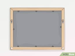 I'm looking to hang a mirror on the wall on my bathroom. How To Hang A Mirror With Wire With Pictures Wikihow