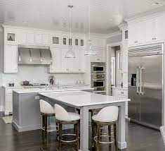 In the picture below the shape of the island. Family Home With Grey Exterior And Interiors Kitchen Island Dimensions T Shaped Kitchen Island Kitchen Island Table With Seating