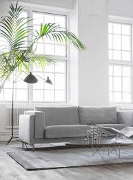 Industrial Style Loft With Huge Windows And High Ceilings Grey Velvet Sofa And Art Deco Details T Ikea Nockeby Sofa Grey Velvet Sofa Cheap Furniture Online