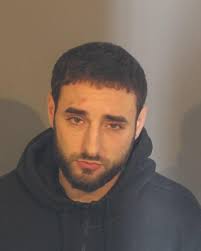 Police: Danbury man threw gun out at police station after shooting leg