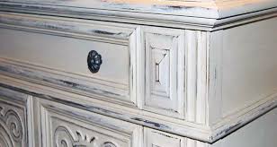 To distress the finish (and make the painted surface look more naturally weathered), take the sander back to the surface of the furniture when the paint has dried. Chalk Paint Pros Cons Are They Good Enough For Kitchen Cabinets