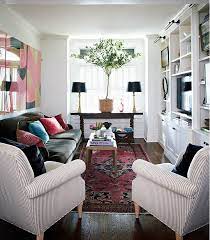 6 Ways To Make Your Small Living Room Feel Bigger The Everygirl In 2021 Narrow Living Room Narrow Living Room Design Long Narrow Living Room