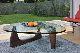 The noguchi coffee table comprises a wooden base composed of two identical curved wood pieces, and a heavy plate tempered glass top. Timeless Sculptural Decor Inspirations By Isamu Noguchi