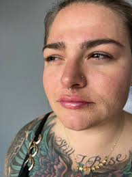 Fresh septum piercing with a rose gold teardrop diamond clicker. For  appointments: (716)-545-3023