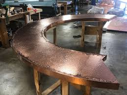 This round hand hammered bar sink can be top mounted or under mounted. Hand Crafted Custom Copper Bar Top With A Hand Hammered Finish Accented Edging And Ornamental Nail Heads Archit Copper Bar Top Copper Furniture Custom Homes