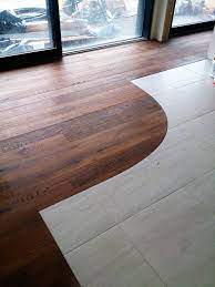 Walnut Engineered Floor Combined With Ceramic Tile Being Fitted By Antares Wood Floors Flooring Ceramic Floor Tiles Wood Tile