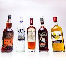 5 Essential Rum Bottles You Need For Your Home Bar Rum Bottle Rum Alcohol Drink Recipes
