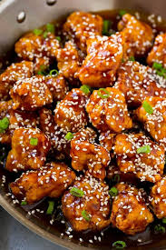 Crispy Sesame Chicken In A Pan Coated In A Sweet And Savory Sauce And Sesame Seeds Sesame Healthy Chicken Recipes Easy Chicken Recipes Sesame Chicken Recipe