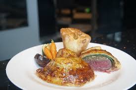 Sausages, eggs, mushrooms, tomatoes, mushrooms, blood pudding, potatoes, and toast. Foods In Britain Top 48 British Food Of British Cuisine