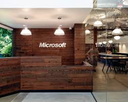 Microsoft S Garage Of Innovation Office Snapshots Reception Desk Design Wood Reception Desk Office Interior Design