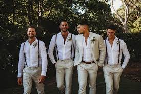 Braces Have Never Looked So Good This Groom And His Groomsmen Are Looking Fine In Their Crisp Beach Wedding Groom Wedding Suits Groom Wedding Groomsmen Attire