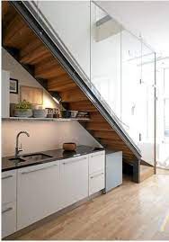 Storage Kitchens Under The Stairs Remodelista Kitchen Under Stairs Stairs In Kitchen Stairs Design Modern