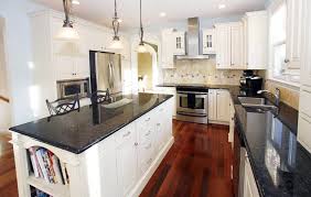 Kitchen With Jatoba Wood Floors And White Cabinets With Black Granite Cherry Hardwood Flooring Cherry Wood Floors Brazilian Cherry Hardwood Flooring