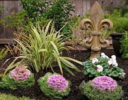 Have a larger space to fill? Love The Fleur De Lis Yard Art Tuscan Style Traditional Landscape Raised Bed Garden Design