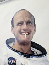 This poster of astronaut Pete Conrad at Space Center Houston has worn away  where people have pointed out the gap in his teeth. : r/mildlyinteresting