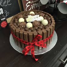 Chocolate Overload Cake I Made For A Friend S Birthday Chocolate Cake With Kitkat On The Sides Malteesers Lindt And Ferre Cake Cupcake Cakes Cake Decorating