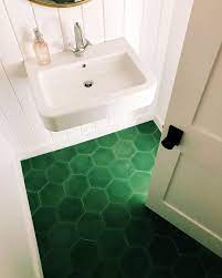Semi gloss is used on the trim for additional subtle contrast. Cement Tile Shop On Instagram We Are Green With Envy We Love Patterns But This Simple Green Green Tile Bathroom Floor Green Tile Bathroom Green Tile Floor
