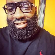 Odell Beckham (senior) and Shaquille O'Neal talking with two young ladies 