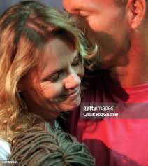 ME.Prom.Maese.0606RG––Chris Maese and Steve Linnes hug while Newport...  News Photo