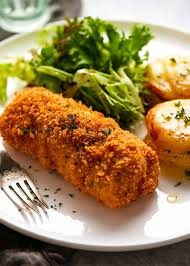 Dip chicken in margarine and then in crumb mixture; Chicken Kiev Recipetin Eats