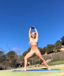 Britney is probably more famous for her shocking escapades than for singing career. Britney Spears Enjoys Bikini Yoga As She Dances To Cardi B People Com