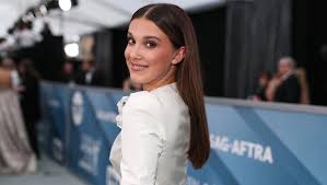 She became one of the youngest faces to represent the popular brand calvin klein at a young age of 12 also landing her first major acting role as eleven in the popular netflix series strangers thing. Millie Bobby Brown At Sag Awards 2020 Rocks Chic White Dress Pants Hollywood Life