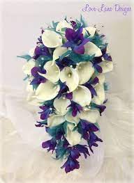 Teardrop bouquet with diamante brooches & pearls. Teal Purple Blue And White Bridal Wedding Teardrop Bouquet With Lilys Orchids And Tufts Of Teal F Blue Wedding Bouquet Teal Wedding Flowers Teardrop Bouquet