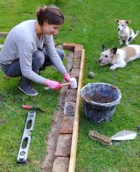 Grandpa shows how to lay a small garden retaining wall without mixing mortar. How To Build Raised Beds From Reclaimed Bricks Alice De Araujo