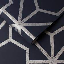 The contemporary design features a striking geometric moroccan style pattern of looping interlocking petal shapes with a. Rinku Navy Silver Wallpaper Grahambrownrow