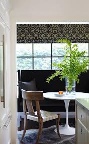 My husband and i agreed that a settee would be a fun addition. Black Wingback Dining Settee And Saarinen Dining Table Transitional Dining Room