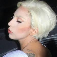 Lady Gaga showing off a platinum blonde bob last night while leaving her  hotel.