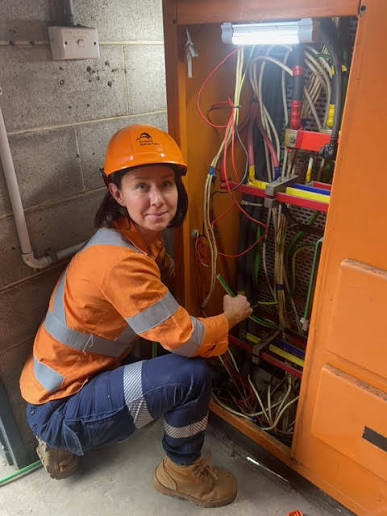 Electrician inspecting fuse box in Bexleyheath