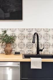 The Amber Interiors Office Kitchen Makeover With Delta Amber Interiors Kitchen Amber Interiors Black Kitchen Faucets