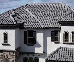 Workers installing roof tiles for home building. Dark Gray Roof Tile Novocom Top