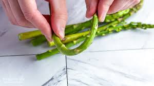 Place the asparagus into a mixing bowl, and drizzle with the olive oil. How To Trim Asparagus Longbourn Farm
