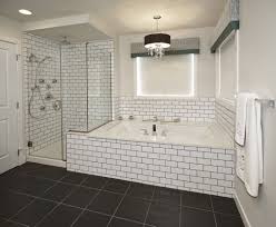 Gray tile flooring with subway tile shower walls and bench. Top Tips On Choosing The Shower Tiles For Your Bathroom Artmakehome