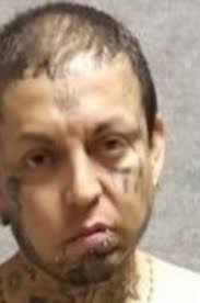 Man charged with murder, assaulting an officer after other man's body found  in truck