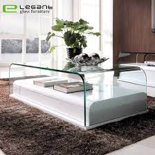 This coffee table's understated design and neutral brown finish make it a perfect fit in most styles and color schemes. China Bent Glass Coffee Tables With Mdf Base China Coffee Table Tea Table