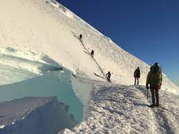 The wind tried it's best to. Mt Rainier Peak Mountain Guides