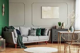 Although the couch and walls are both gray, the sofa is many shades darker, so it stands out against the walls. What Color Wood Floor Goes With Gray Walls Designing Idea