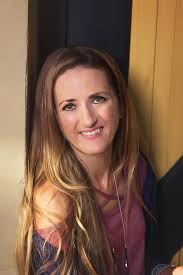 Can someone edit my photo to change my top to bright blue or black and make  the background white?