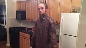 Okay, so amidst the countless memes including this photo (don't worry, we'll get onto them), you've probably wondered at least once. Tracksuit Robert Pattinson Standing In The Kitchen Know Your Meme