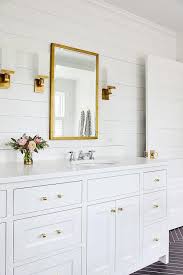 White, on the other hand, is a pure, clean and clear bringer. Stunning White Bathroom With Gold Accents Boasts A Restoration Hardware Rivet Mirror Hung From A White Shiplap Wa White Bathroom Gold Bathroom Shiplap Bathroom