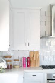 Maybe you would like to learn more about one of these? Timeless Kitchen Includes White Shaker Cabinets White Quartz Countertops And White Square Backsplas Trendy Kitchen Tile Timeless Kitchen White Tile Backsplash