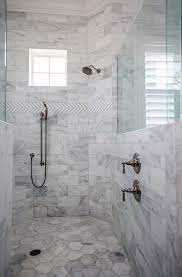 By keeping the walls and the vanity simple and neutral, the designer is able to experiment with the shower and floor tiles and create a load of visual interest with this starburst pattern. Top 50 Best Shower Floor Tile Ideas Bathroom Flooring Designs