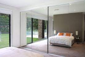Some of the most beautiful vintage mid century. The Sliding Mirror Closet Doors Are Plycorr A Densely Corrugated Cardboard Tha Sliding Door Wardrobe Designs Mirrored Wardrobe Doors Sliding Wardrobe Doors